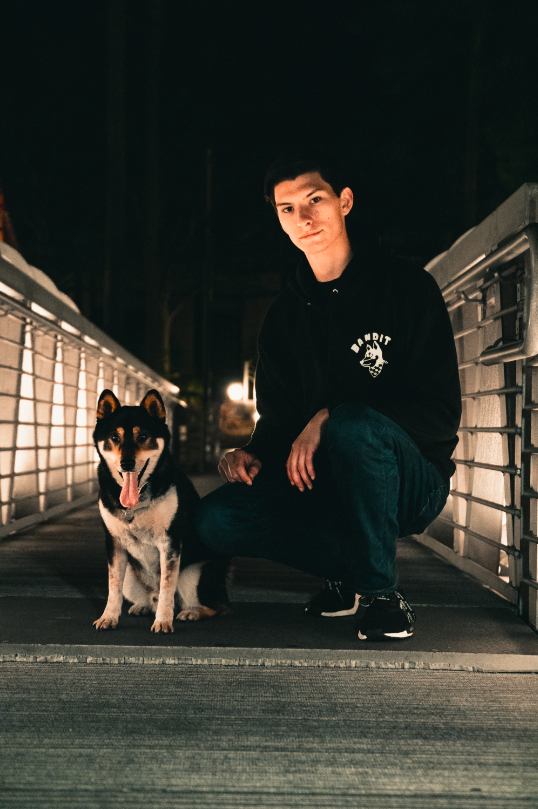 Bandit Logo hoodie black front side man and dog sitting on bridge